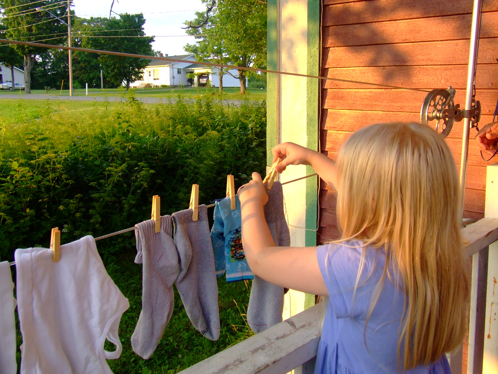 Clothes Hanging To Dry on Clothesline Outdoors Inside Yard of