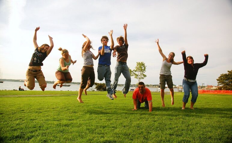 eight adults jumping