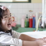 Child washing hands, by Aikawa Ke, cc.