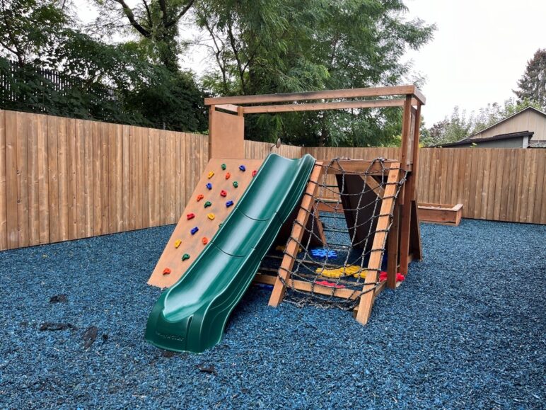 The backyard at Grandma’s House is for kids, not cars. Photo by Catie Gould. 